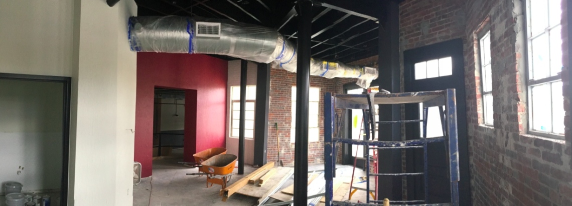 Looking east from the counter area of the barbecue restaurant. At the back left (red wall) is the entrance into 118 S. Park Ave.